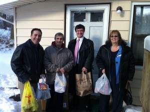 Dr Bret Hartman, Art Bonito, Rob DiCerbo and Sue Bolleen delivering food to the Star of the Sea pantry.