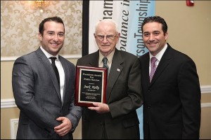 Jack Kelly receiving his award from Chris Brancato and Dr Bret Hartman